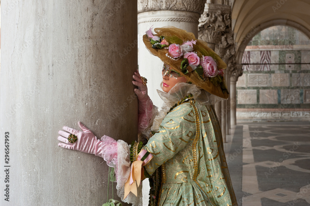 Female carnival mask in Piazza San Marco in Venice during the carnival. Italy Female carnival mask in Piazza San Marco in Venice during the carnival. Italy