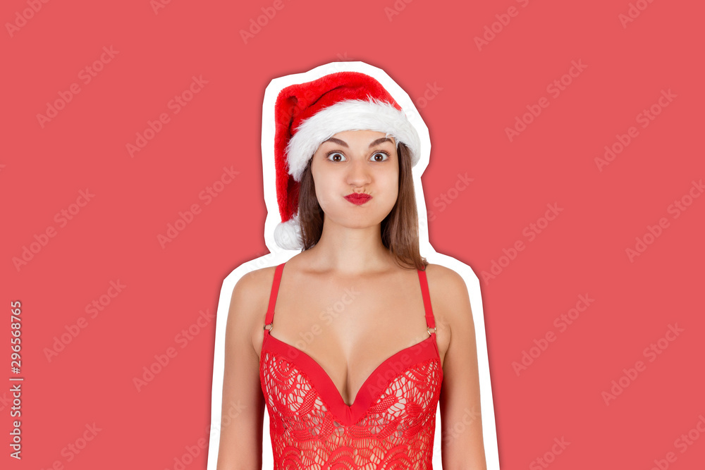 Beautiful funky and emotional girl in Christmas swimsuit. emotional woman in red santa claus hat Magazine collage style with trendy color background. Happy Christmas and New Year holidays concept Beautiful funky and emotional girl in Christmas swimsuit. emotional woman in red santa claus hat Magazine collage style with trendy color background. Happy Christmas and New Year holidays concept