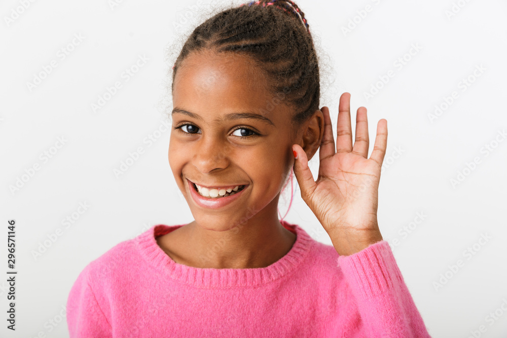 Image closeup of cheerful african american girl touching her ear Image closeup of cheerful african american girl touching her ear