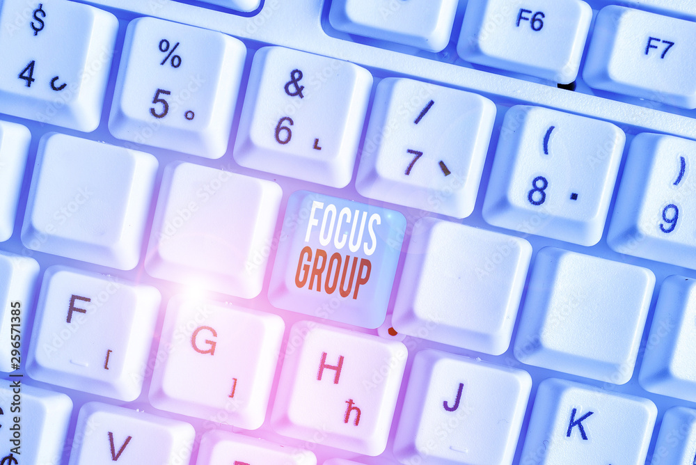 Writing note showing Focus Group. Business concept for showing assembled to participate in discussion about something White pc keyboard with note paper above the white background Writing note showing Focus Group. Business concept for showing assembled to participate in discussion about something White pc keyboard with note paper above the white background