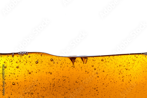Beautiful wave of high viscosity of base oil and air bubble inside the oil isolated on white background, used as wallpaper, industrial concept