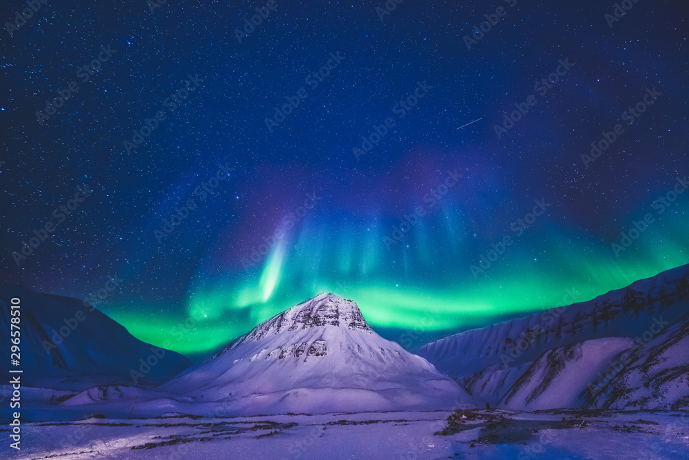 The polar arctic Northern lights hunting aurora borealis sky star in Norway travel photographer  Svalbard in Longyearbyen city the moon mountains
