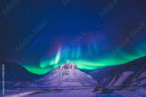 The polar arctic Northern lights hunting aurora borealis sky star in Norway travel photographer  Svalbard in Longyearbyen city the moon mountains