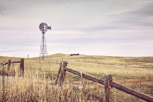 American countryside with an old windmill tower, color toning applied, USA.