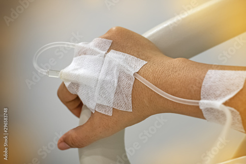 The patient hand with IV solution,for treatment