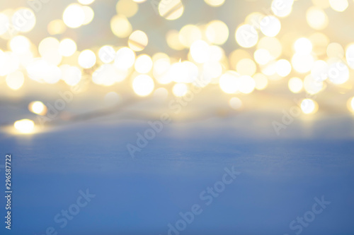 Abstract background with top bokeh light and flat light blue at foreground.
