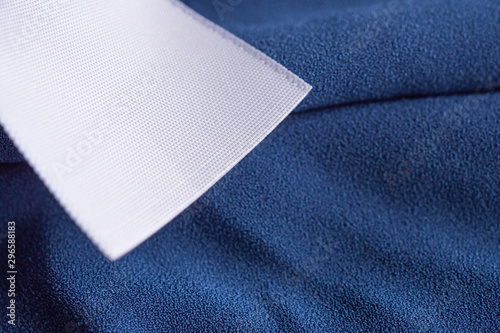 laundry care clothing label on blue dress