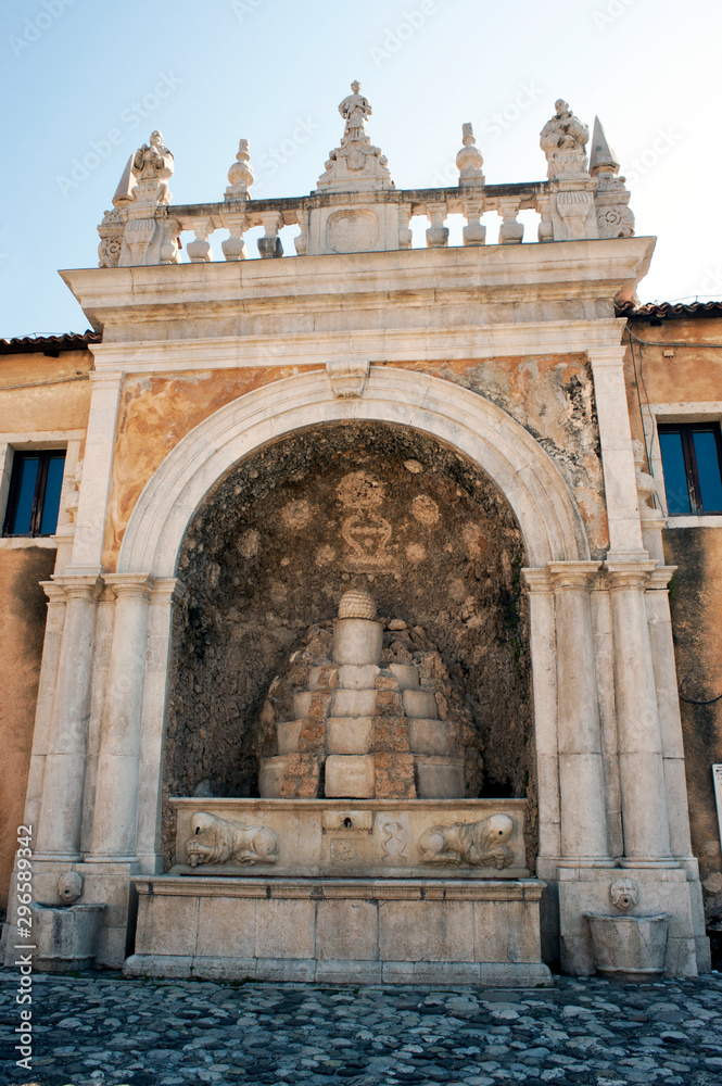 Obraz premium A monumental ancient fountain in the courtyard of the charterhouse of Padula, Salerno, Italy
