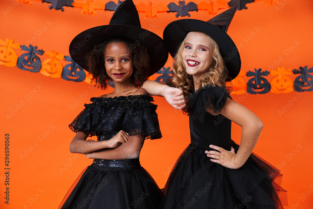 Obraz premium Image of cute multinational girls smiling and standing together