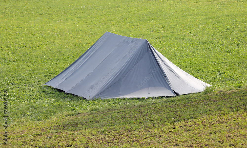 One big tent on the green meadow