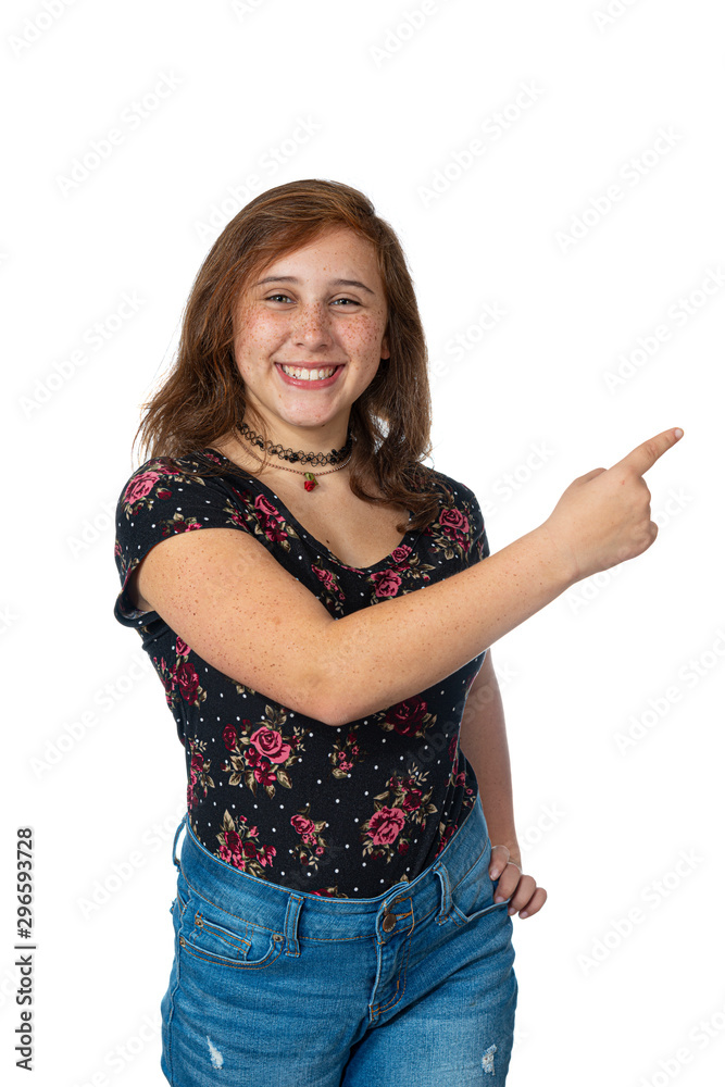 Smiling Pre-Teen Girl Pointing Isolated On White Smiling Pre-Teen Girl Pointing Isolated On White