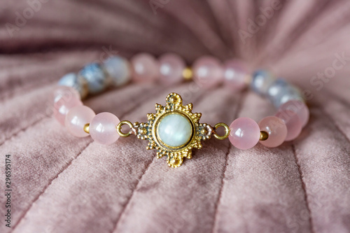 Beautiful mineral stone bracelet on pink velvet photo