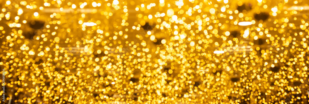 Christmas and new year banner with gold bokeh lights abstract background Christmas and new year banner with gold bokeh lights abstract background