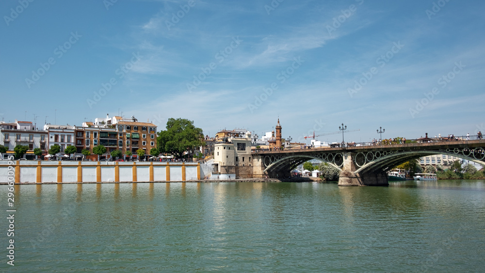 Puente de Isabel II por Puente de Triana, bridge connecting the Triana neighborhood with the historic centre of the city crossing the Guadalquivir River, Seville, Andalusia,  Spain