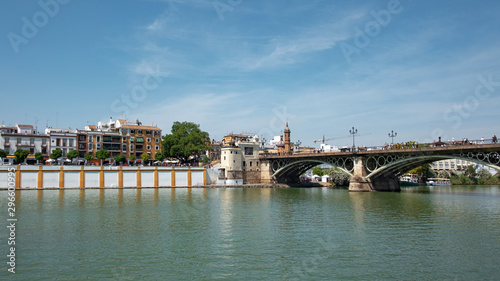 Puente de Isabel II por Puente de Triana, bridge connecting the Triana neighborhood with the historic centre of the city crossing the Guadalquivir River, Seville, Andalusia, Spain