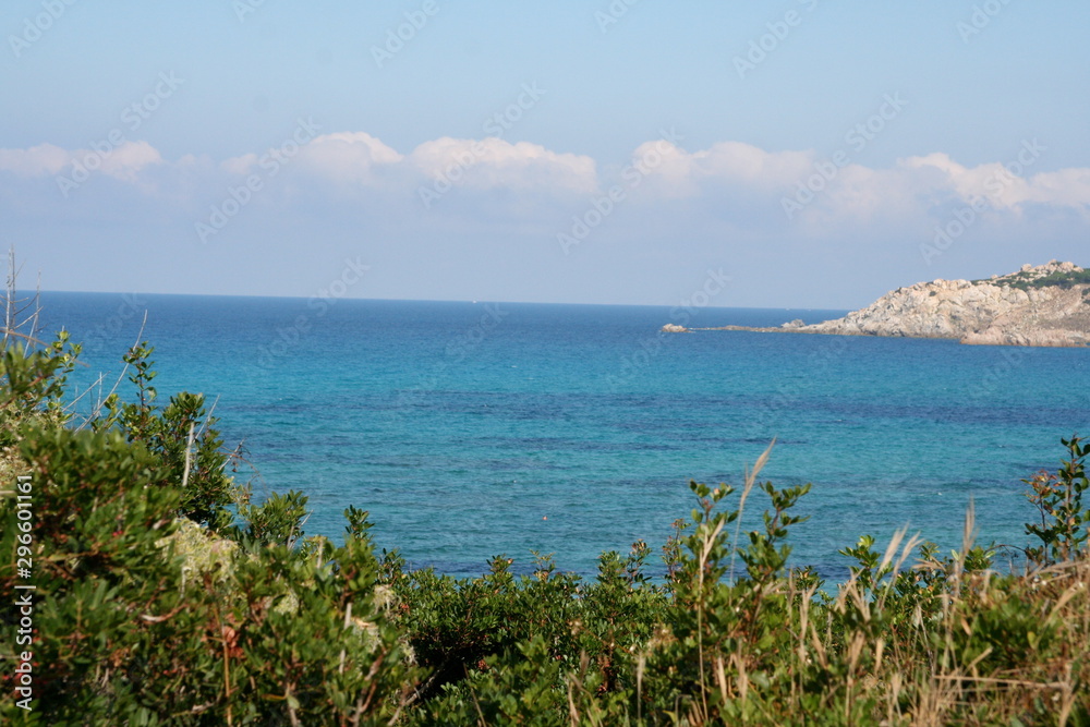 beautiful view of the crystal clear sea of the coast of Sardinia near the red island