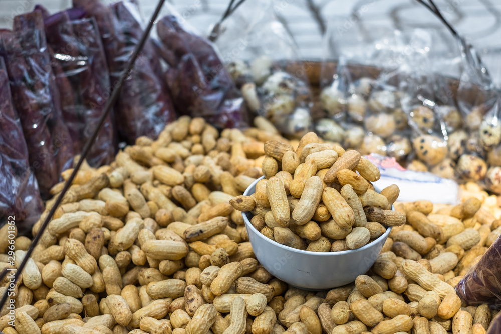 Boiled cooked nut at street food in Thailand. Food travel.