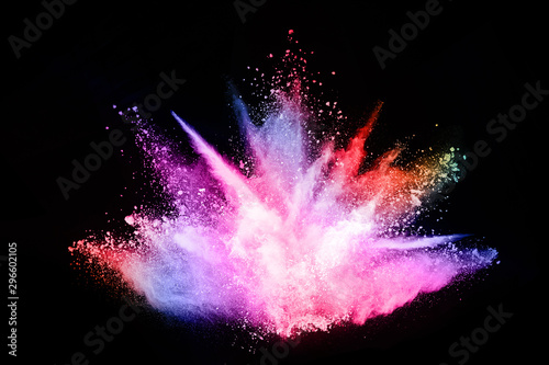 abstract colored dust explosion on a black background.abstract powder splatted background,Freeze motion of color powder exploding/throwing color powder, multicolored glitter texture.