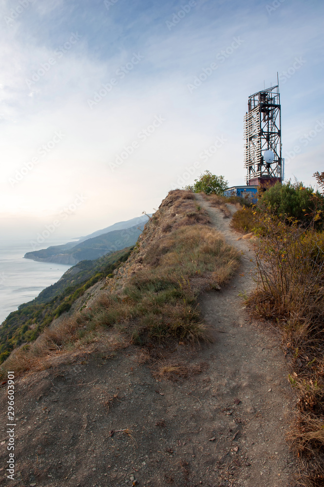 Old tower lighthouse on the cliff over the sea Old tower lighthouse on the cliff over the sea