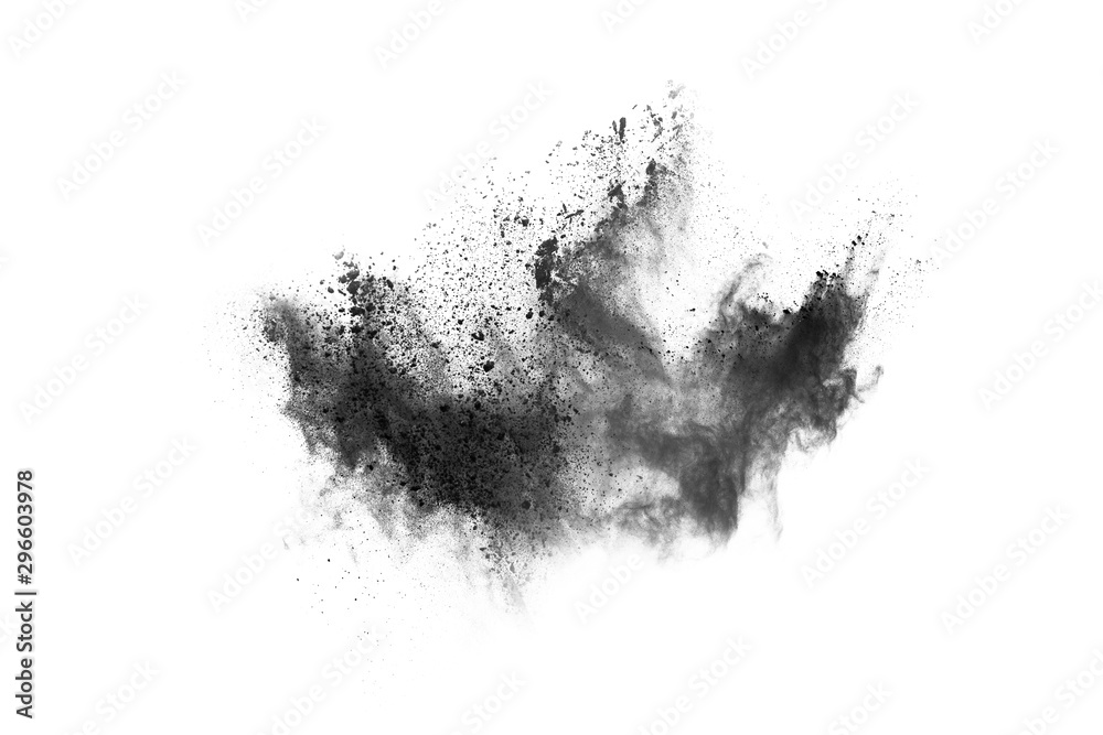 Closeup of black dust particles explode isolated on white background..