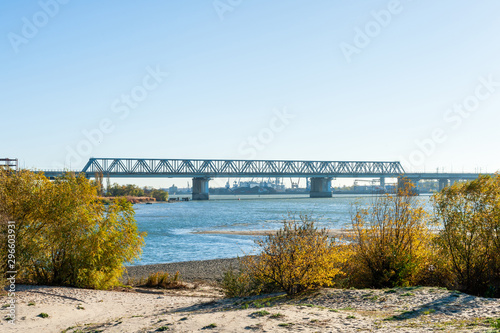 Steel bridge over the river in atumn season