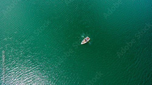 Aerial view. Two in a boat sailing on the lake