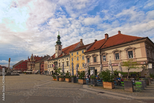 Maribor, Slovenia-September 23, 2019: Panoramic view medieval buildings against vibrant autumn sky. The Rotovz Town Hall Square in Maribor. Famous touristic place and travel destination in Slovenia