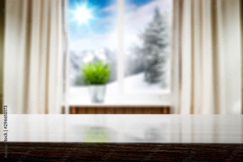 Desk of free space and winter window background Desk of free space and winter window background