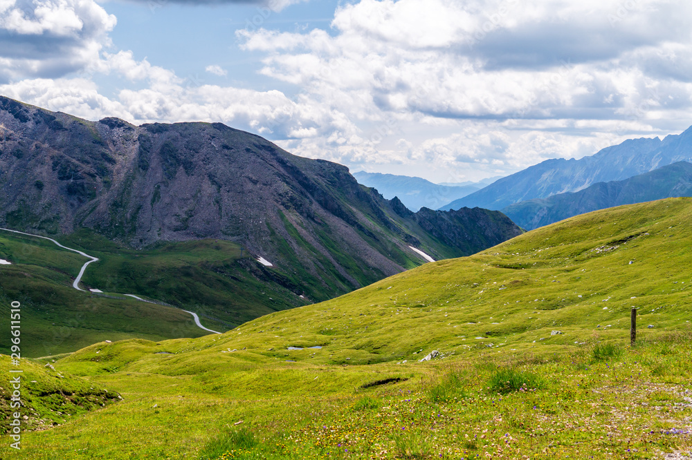 Green meadow and scenic mountains along Grossglockner High Alpine Road, Austria