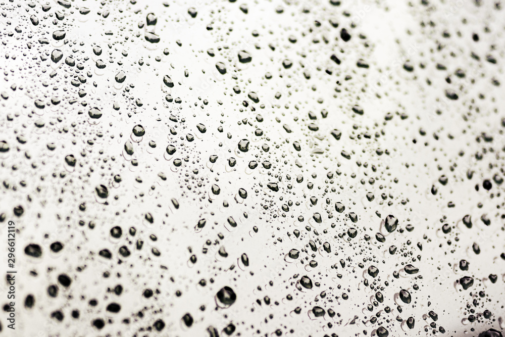 Autumn rain on the car glass. Water drop on windshield background texture.