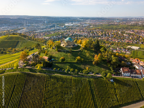 Aerial of the Grave Chapel (Grabkapelle) on Rotenberg and surrounding industrial area with museums and soccer stadium on a beautiful autumn day in Stuttgart, Germany photo