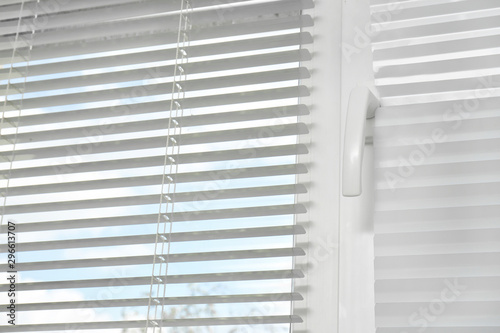 Window with modern horizontal blinds indoors