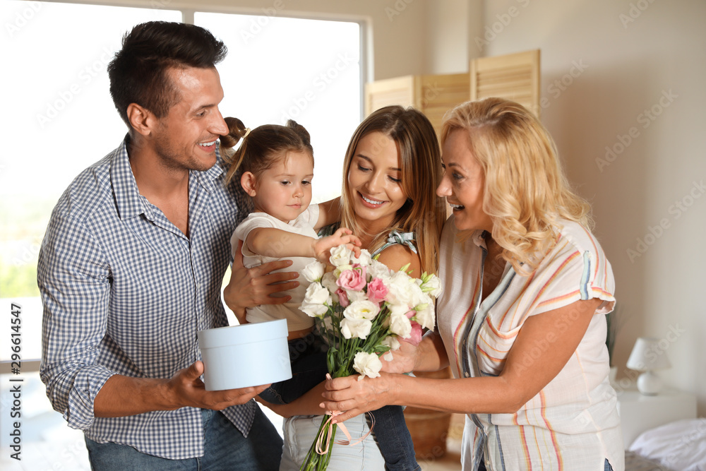 Happy family congratulating little girl at home Happy family congratulating little girl at home