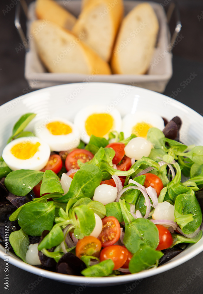 Salad egg mixed with spinach tomatoes, meal food delicious diet for healthy.