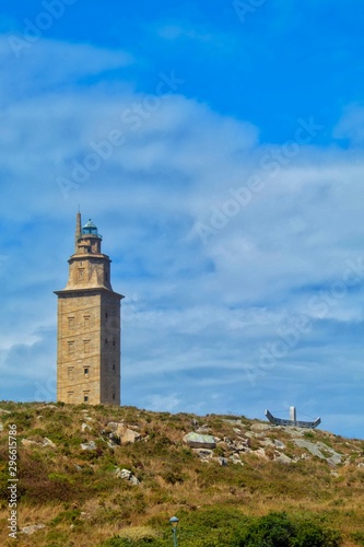 lighthouse on coast of sea © yacald