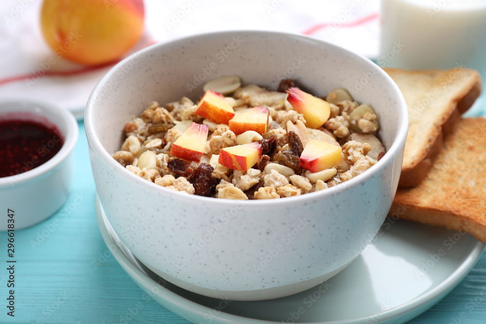 Muesli with peaches on light blue wooden table. Healthy breakfast Muesli with peaches on light blue wooden table. Healthy breakfast