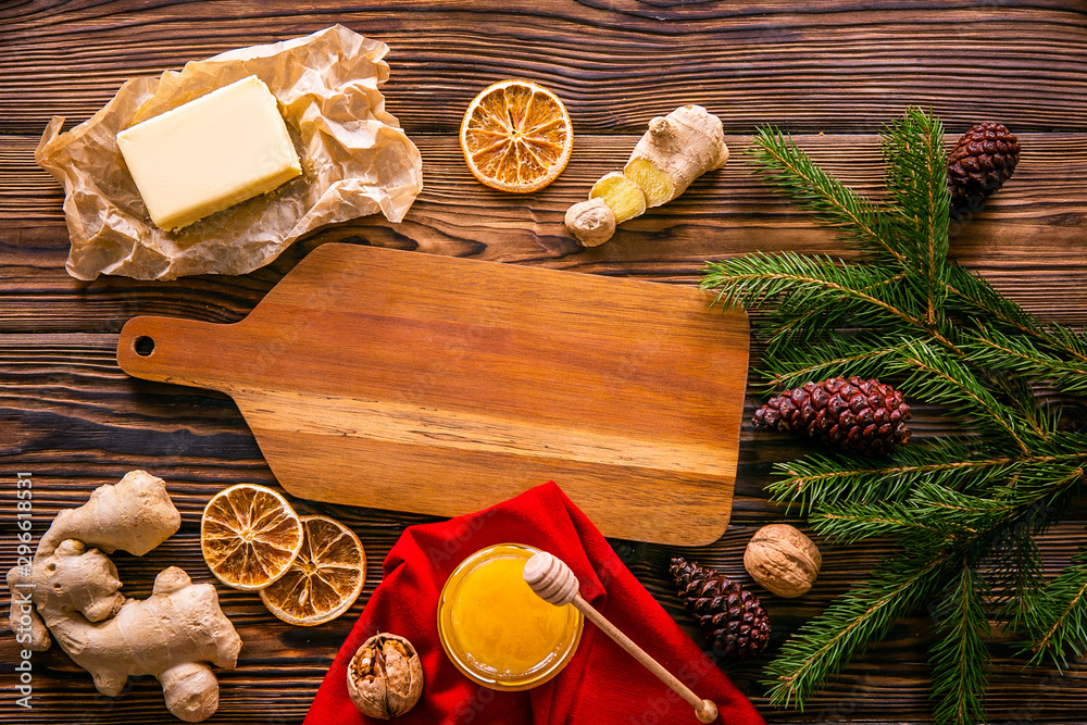 Traditional christmas holidays pastry ingredients and various kitchen utensils on wood textured table. Ginger cookies recipe concept. Close up, copy space, top view, flat lay, background.