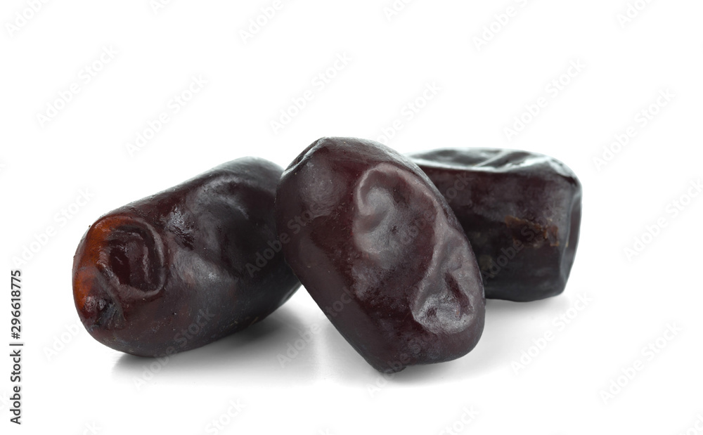 A few dried dates. Isolated on white background. A few dried dates. Isolated on white background.