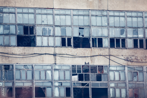  industry abounded house wall with broken glass windows