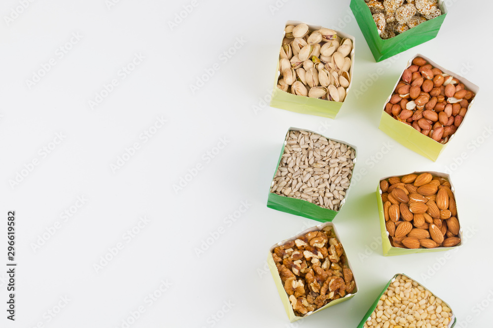 Paper bags with pistachios sunflower seeds walnuts cashew peanut almond pine nuts
