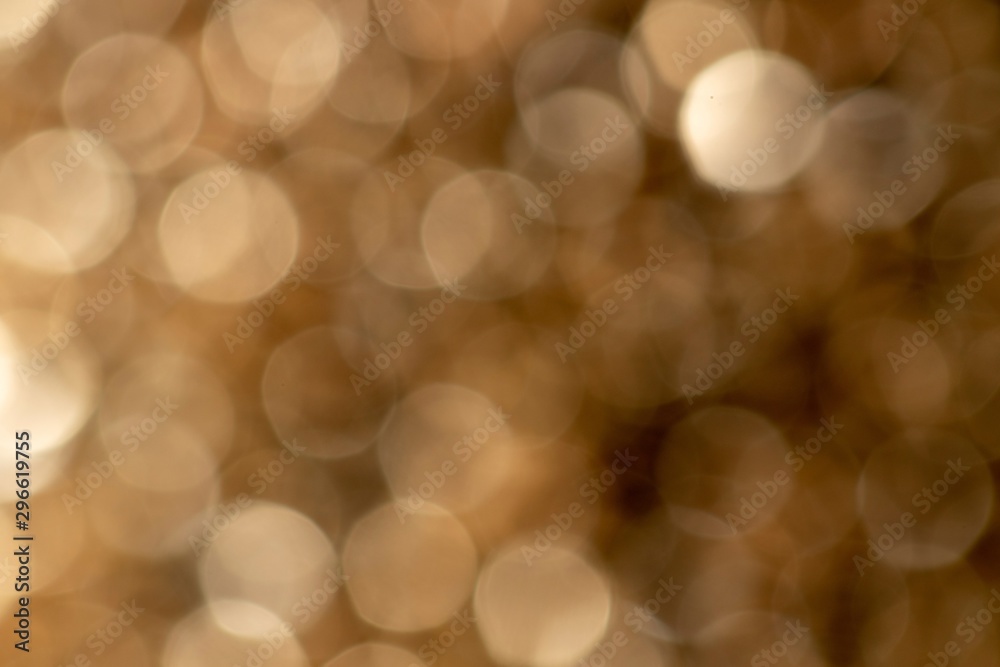 Obraz premium A portrait of a nice gold color bokeh background. The golden blur is something magical.
