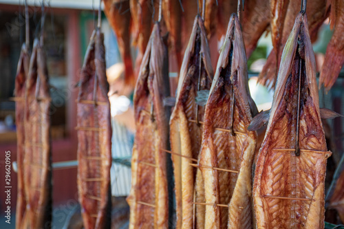 Various dry smoked fresh fish in a market, close up