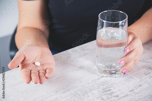 woman hand drug with water