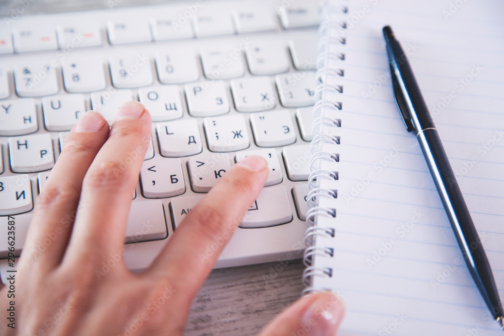 man hand keyboard with notepad man hand keyboard with notepad