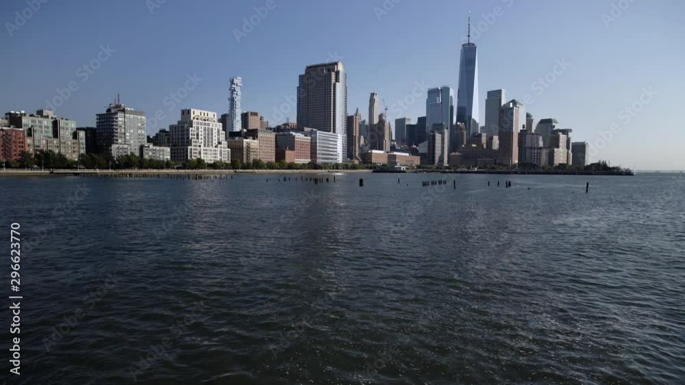 Walking over bridge with a view of downtown NEW YORK CITY, USA on a cloudless day Walking over bridge with a view of downtown NEW YORK CITY, USA on a cloudless day