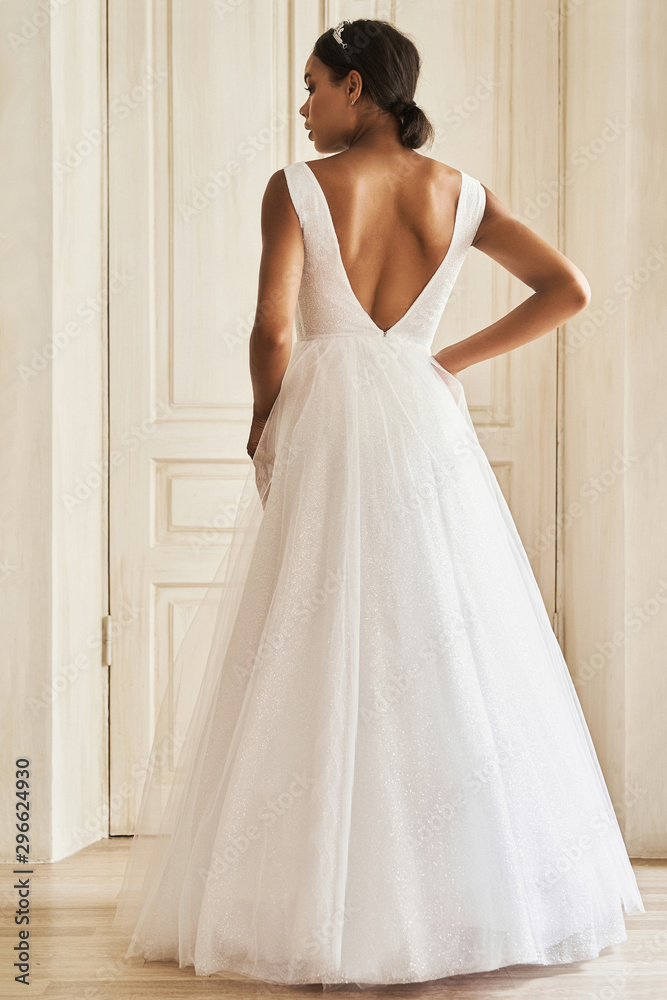 Dark-skinned bride posing in a wedding dress Dark-skinned bride posing in a wedding dress