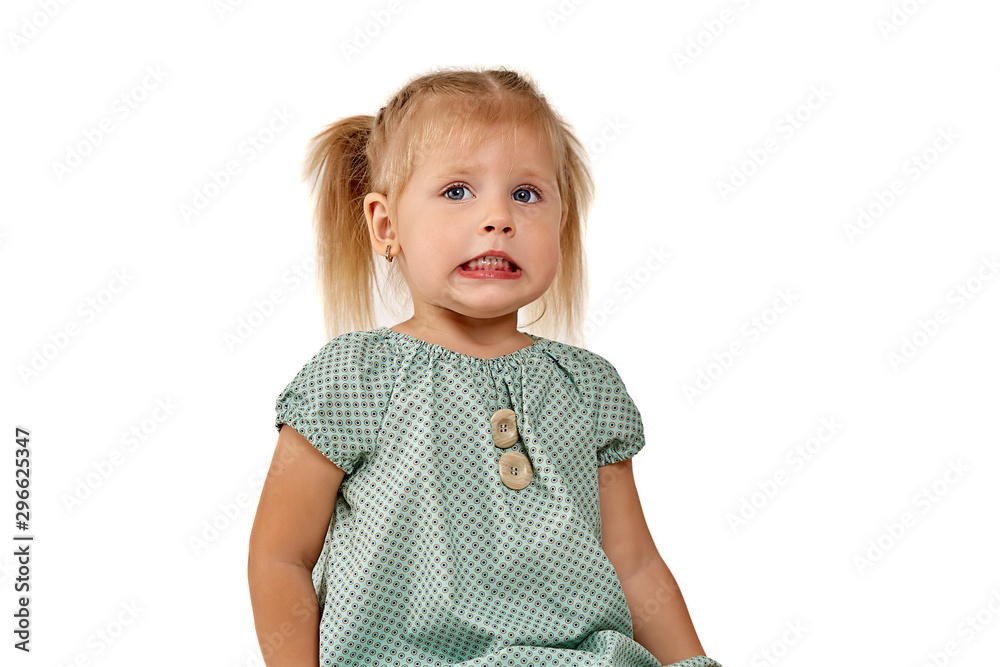 Studio portrait of a teenager beautiful girl. Emotions of a little girl on a white isolated background. Studio portrait of a teenager beautiful girl. Emotions of a little girl on a white isolated background.