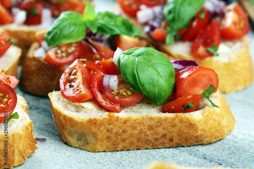 fresh tomato bruschetta. italian food appetizer with basil on table