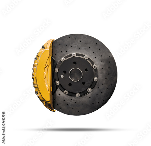 Ceramic disc brake with yellow caliper isolated on a white background