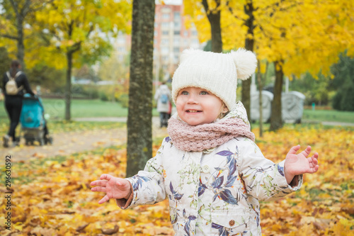 Little girl walking with big soft toy